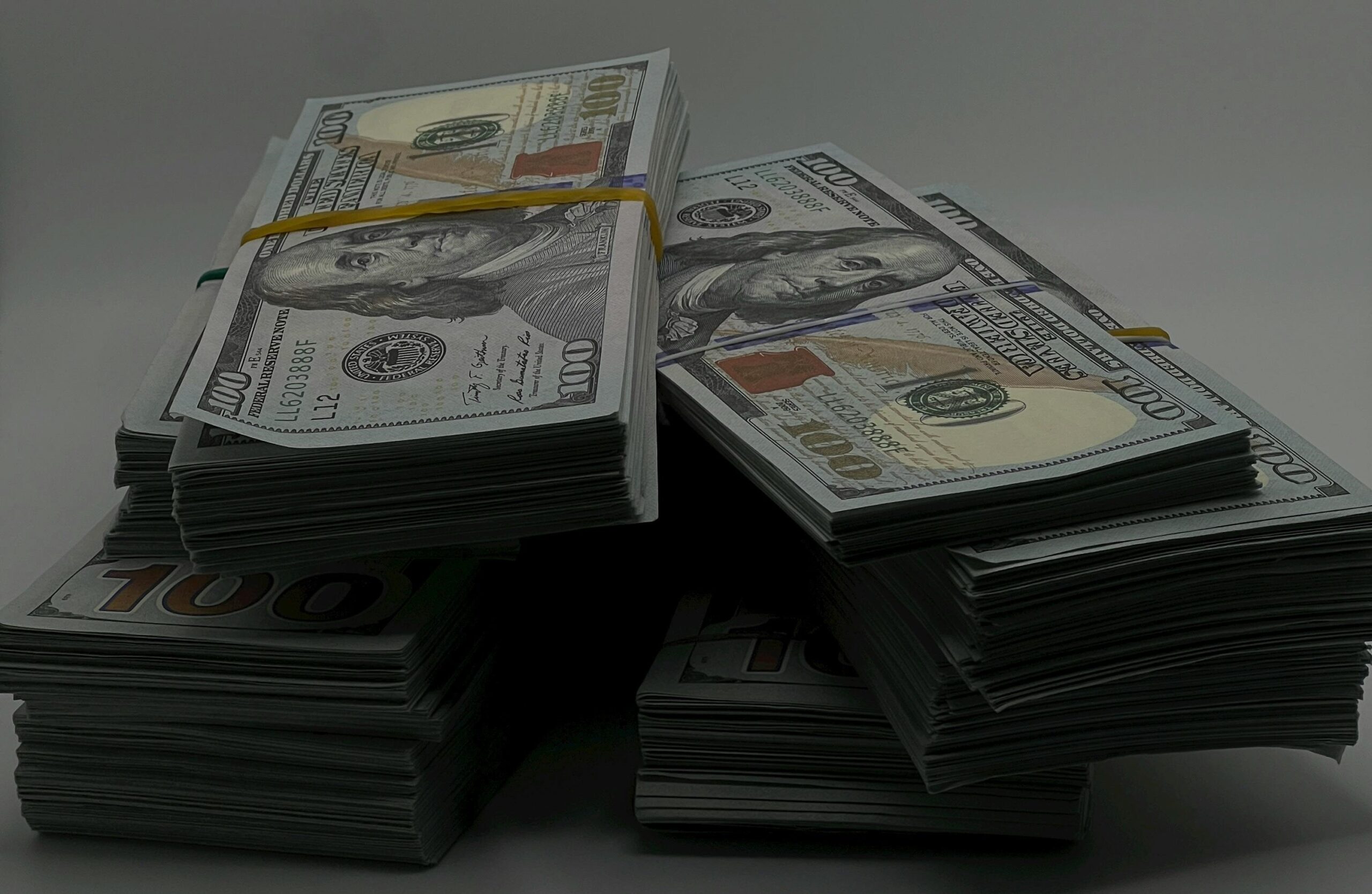 Stack of hundred dollar bills for bail bond money